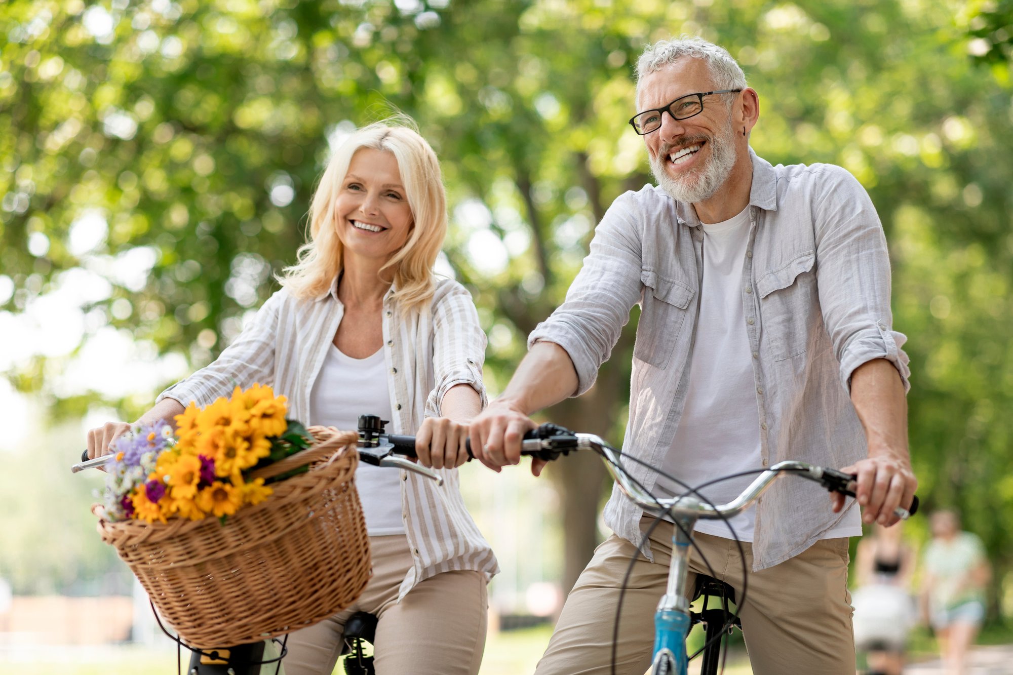 Middle-aged couple riding bicycles