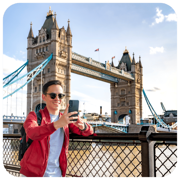 Man taking selfie at Tower Bridge in London