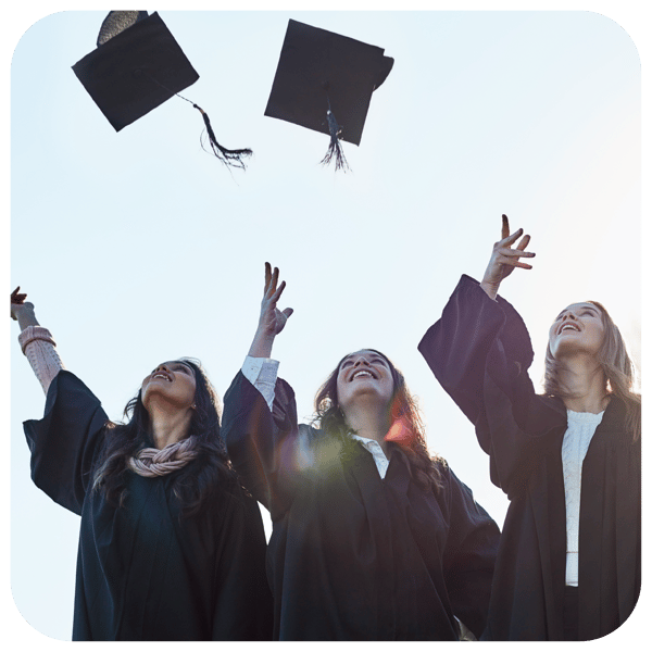 College graduates tossing caps in the air